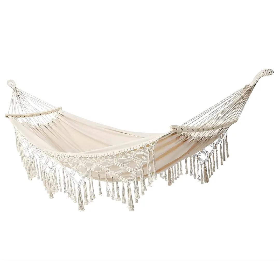 Beige tassel hammock with wooden spreader bars and tassel edging