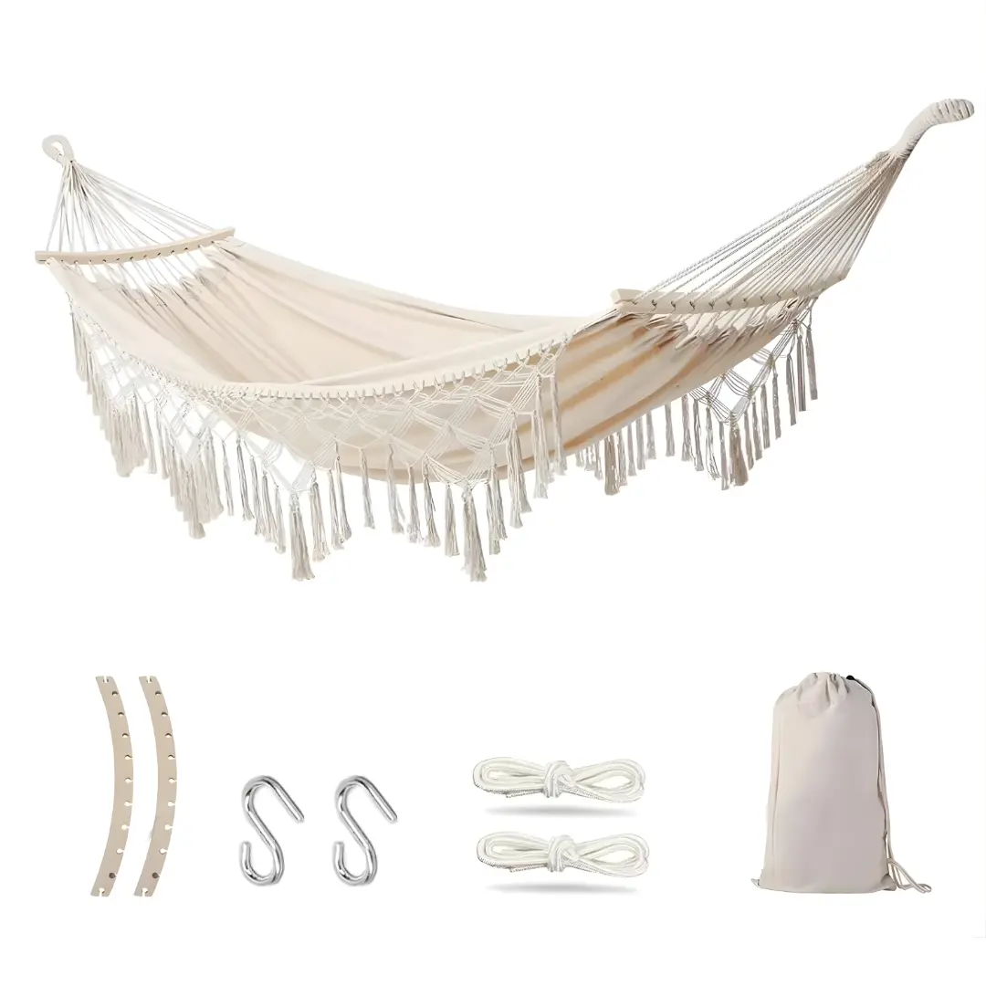 White tassel hammock with wooden spreader bars and suspension ropes