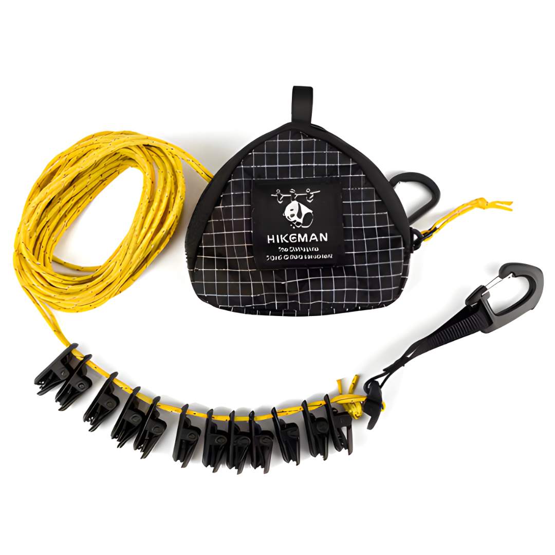 Adjustable camping clothesline with clips and storage pouch on white background