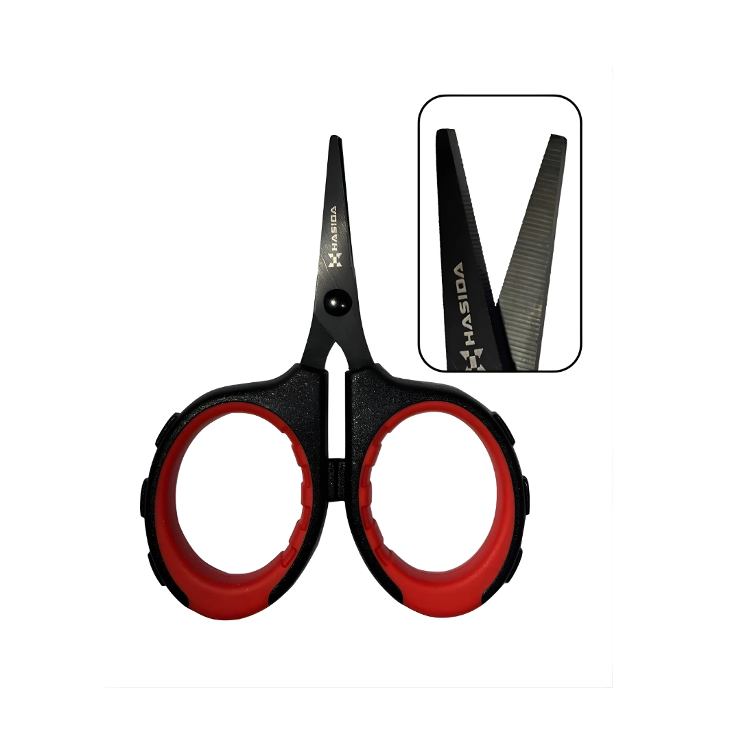 Close-up of stainless steel fishing line scissors with serrated blades